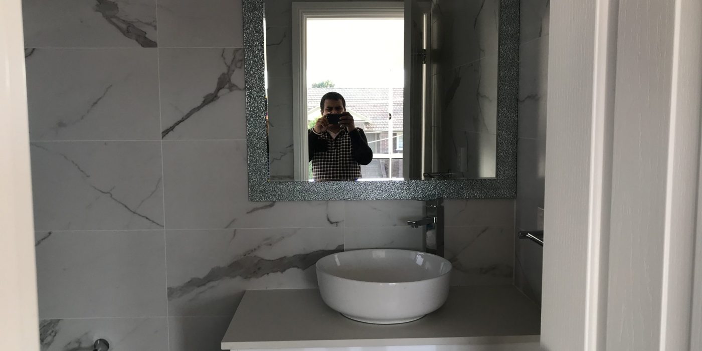 bathroom with white marble tiles